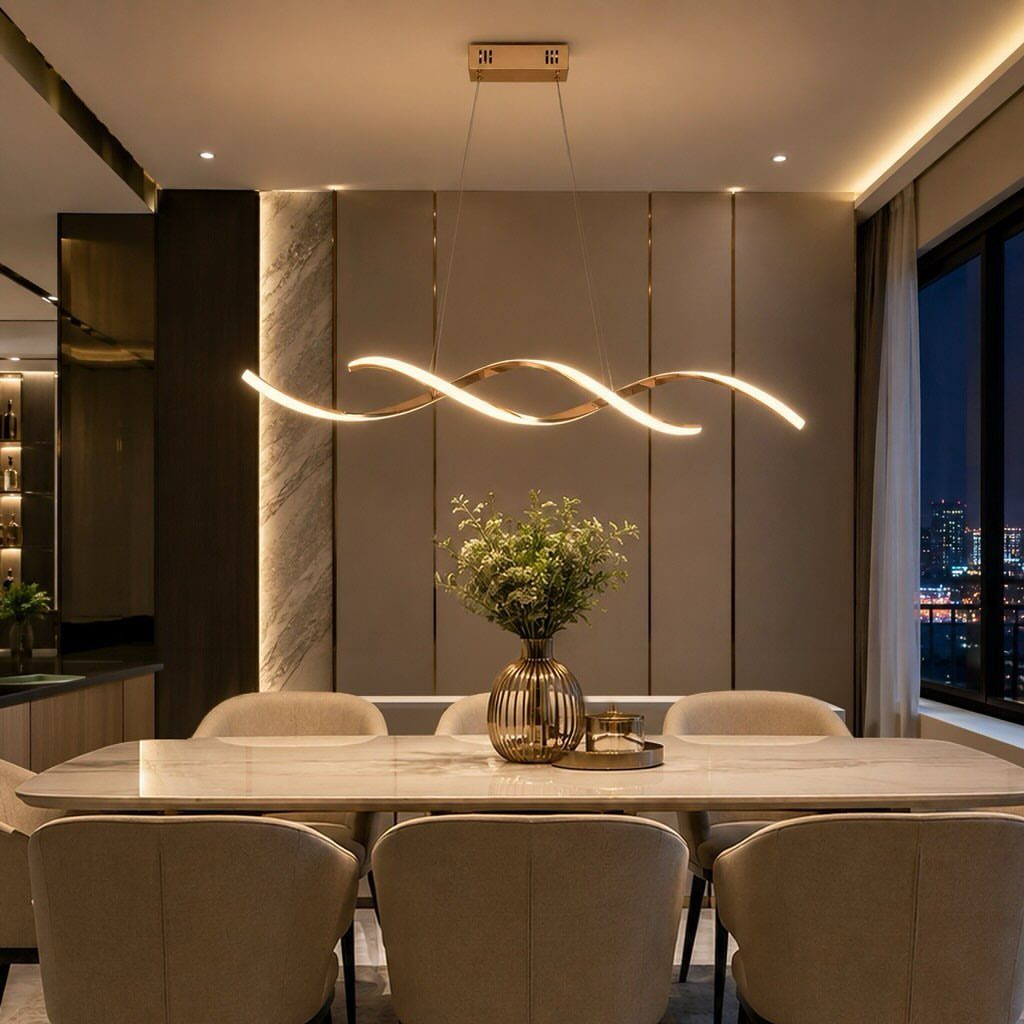 11 Minimalist Dining Room Decor Ideas for Calm, Collected Spaces 7 A wavy sculptural gold pendant light hangs over a marble dining table with beige chairs.