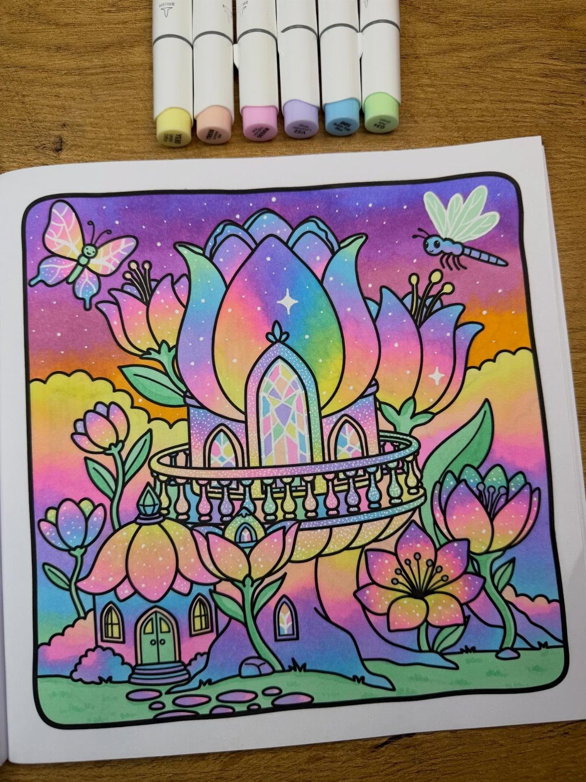 Dream Garden Drawing: 10 Ideas for Your Next Sketch 2 A vibrant fantasy garden drawing with lotus houses, colorful flowers, and insects under a sunset sky.