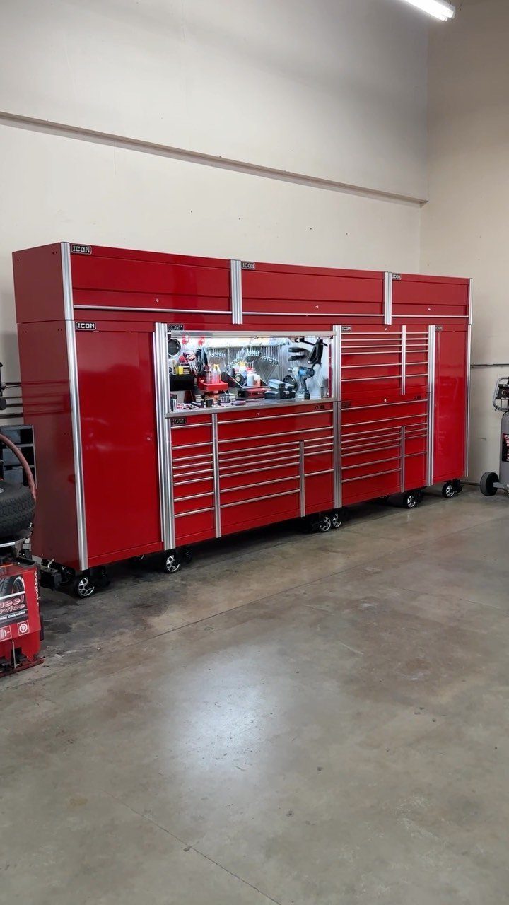 Garage Storage and Workshop: 8 Ideas That Actually Fit 2 Red professional tool storage cabinets and workstations on wheels in a workshop.