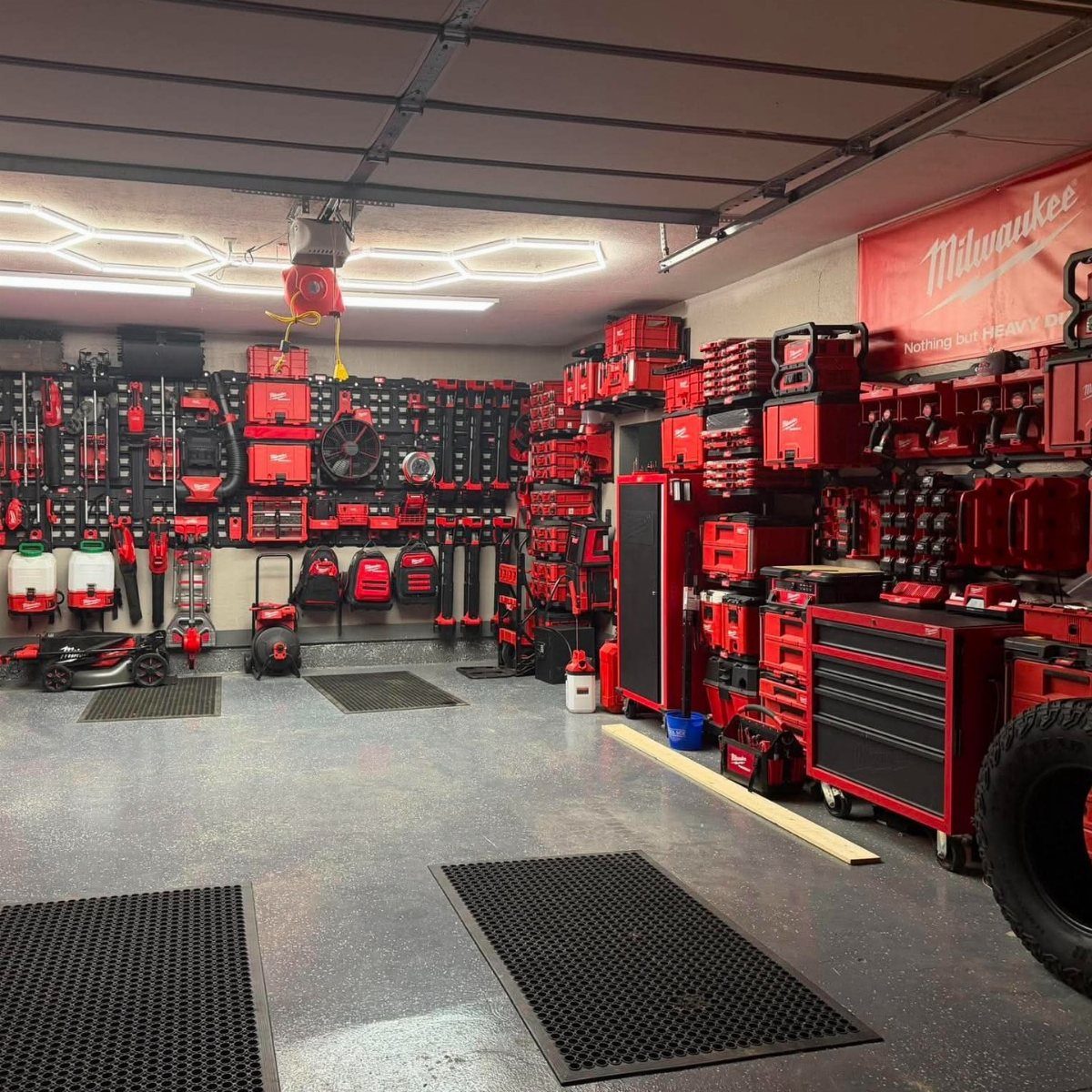 Garage Storage and Workshop: 8 Ideas That Actually Fit 5 Red Milwaukee tool chests and storage cabinets organized neatly along the walls of a clean garage workshop.