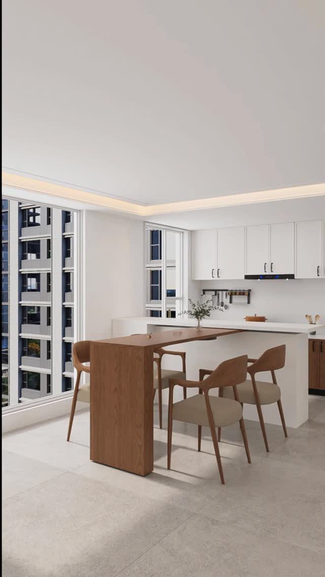 Modern white kitchen with a wooden multi-level island and three dining chairs near large windows.