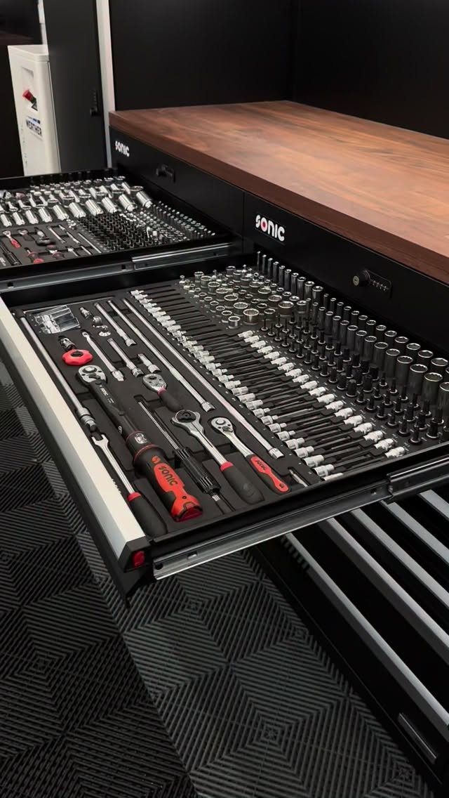 22 Organize a Garage Ideas for Workbenches, Zones & Wall Systems 16 Open tool chest drawers displaying organized sockets, wrenches, and hand tools on foam inserts.