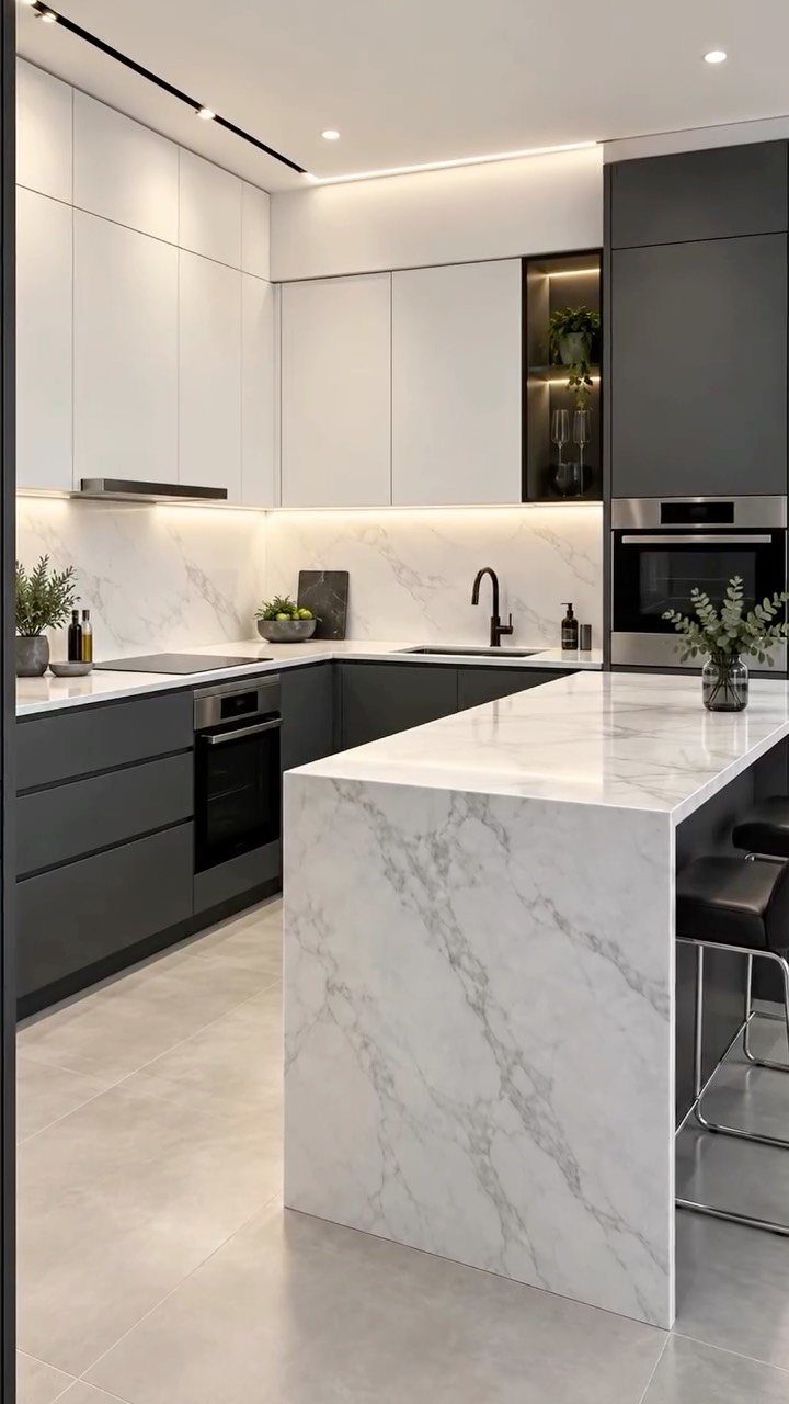 20 Sleek Kitchen Cabinet Design Ideas for 2026 7 Modern kitchen with white upper cabinets, dark lower cabinets, and a large marble waterfall island.