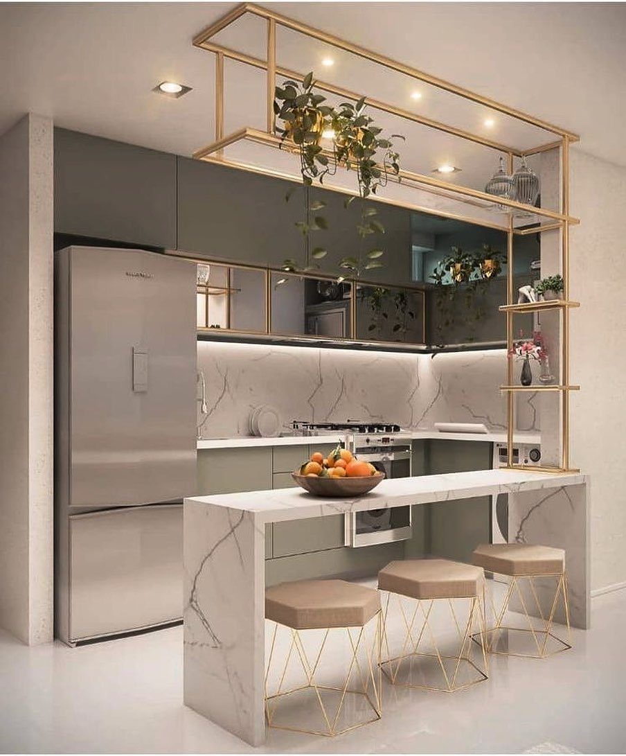 14 Small Apartment Storage Hacks and Genius Finds for 2026 12 Modern kitchen with grey cabinets, marble counters, and a gold metal hanging shelf unit.