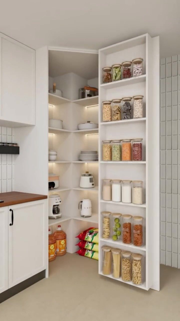 White built-in pantry shelves filled with organized clear containers of various dry food goods.