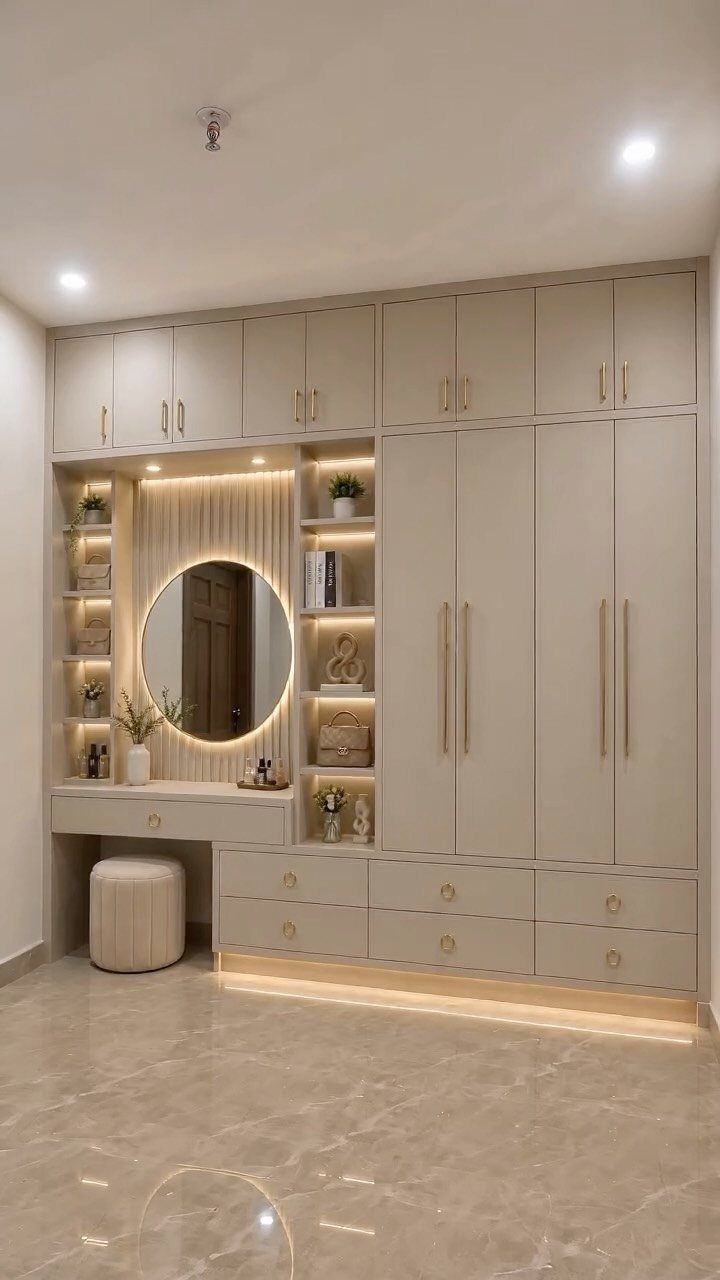 Built-in beige custom closet system with integrated vanity, shelving, and drawers in a modern room.